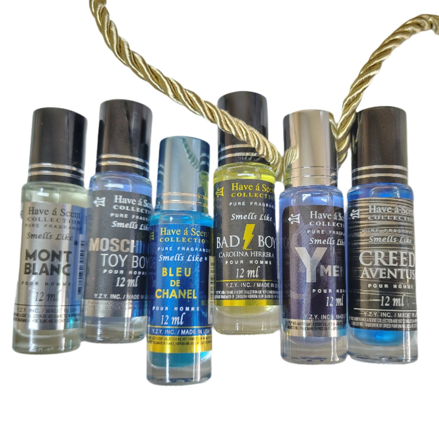 Collection of small perfume bottles with visible brand names on a white background